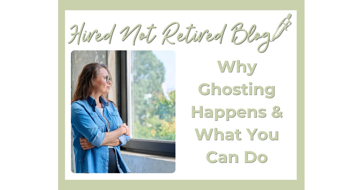 woman standing next to a window gazing out